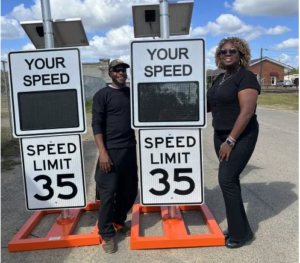 City officials posing with Radarsign's Mobile Patrol Stand radar speed signs in Meigs, Georgia