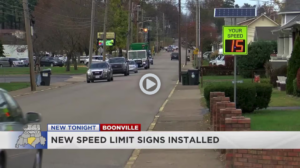 A Radarsign TC-600 radar speed sign displaying a speed of 15 mph on a busy street in Boonville, Indiana